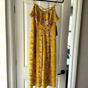 NWT size Large cropped yellow floral jumpsuit by Trixxi Clothing Company.